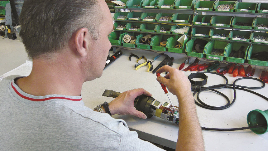Man repairing Leister TRIAC